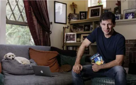 ?? CHRISTINA GANDOLFO/THE NEW YORK TIMES ?? Bestsellin­g author Max Brooks’ new novel, Minecraft: The Island, is based on the incredibly popular video game Minecraft. “I wrote it for me. I’m a fan first.”