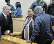  ?? Picture: WERNER HILLS ?? MOVING ON: Attorney Alwyn Griebenow, left, with city manager Noxolo Nqwazi and suspended housing head Mvuleni Mapu during an earlier appearance