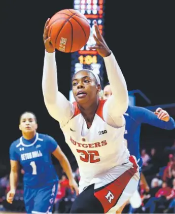  ?? Mel Evans, AP ?? Rutgers center Desiree Keeling grabs a loose ball during the second half of Tuesday’s game against Seton Hall in Piscataway, N.J. Rutgers won 53-45. Keeling finished with eight points.
