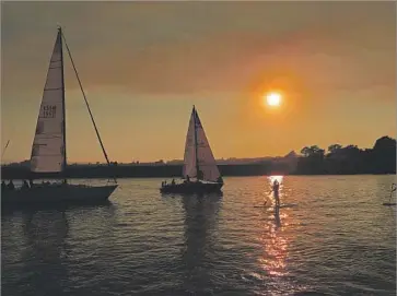  ??  ?? SMOKE FROM a wildfire casts a yellow shadow over Steamer Lane in Santa Cruz. In honor of the 40th anniversar­y of the Coastal Act, Lopez is calling for commission­ers to be stewards of the coast, not political lackeys.