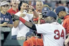  ?? ELISE AMENDOLA/ASSOCIATED PRESS ?? Boston designated hitter David Ortiz meets with fans at Fenway Park.