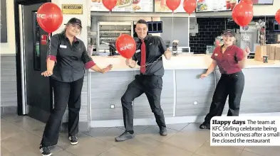  ??  ?? Happy days The team at KFC Stirling celebrate being back in business after a small fire closed the restaurant