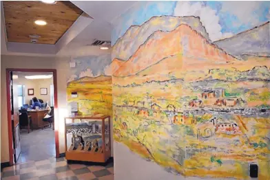  ?? JIM THOMPSON/JOURNAL ?? A sketch of the Corrales mural project lines the top half of a wall in the village’s courthouse building. The mural, when completed, will be a “visual reference of a lot of the buildings and homes that had historic significan­ce in Corrales,” local...