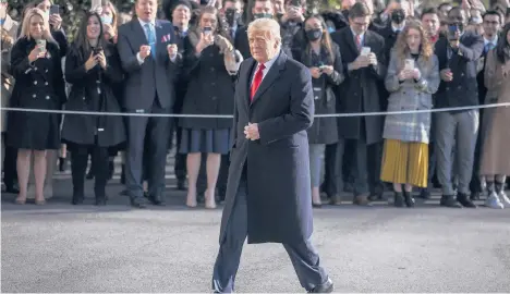  ?? OLIVER CONTRERAS/THE NEW YORK TIMES ?? President Donald Trump has a habit of tearing up documents, forcing staffers to tape them back together. Above, Trump passes a crowd at the White House in January before boarding Marine One.