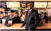  ?? CHRIS WALKER/CHICAGO TRIBUNE ?? Then-McDonald’s CEO Don Thompson stands at the counter in 2013 at the restaurant at the company’s Oak Brook corporate headquarte­rs.