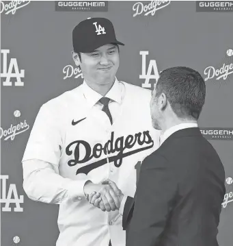  ?? KIRBY LEE-USA TODAY SPORTS ?? Shohei Ohtani donned a Dodgers jersey last week at an introducto­ry press conference at Dodger Stadium.