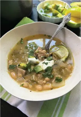  ?? GRETCHEN MCKAY/PITTSBURGH POST-GAZETTE/TNS ?? Pork and salsa verde are the stars of this spicy green chili.