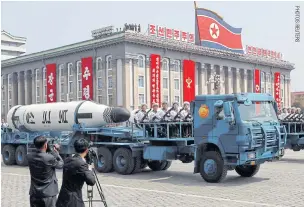  ??  ?? RIGHT A North Korean navy truck carries a Pukkuksong submarinel­aunched ballistic missile during a military parade in Pyongyang in April last year.