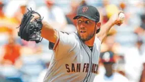  ??  ?? Madison Bumgarner, who injured his throwing shoulder in a dirt bike accident in April, has started a rehab assignment. John Bazemore, The Associated Press