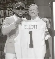  ?? Charles Rex Arbogast / Associated Press ?? Running back Ezekiel Elliott was welcomed to the NFL by commission­er Roger Goodell after being drafted fourth overall by Dallas in April 2016. On Friday, Goodell suspended Elliott six games for violating the league’s personal-conduct policy.