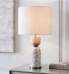  ?? WEST ELM ?? Roar & Rabbit’s terrazzo table lamp from West Elm incorporat­es the material without the cost and commitment of a large-scale project.