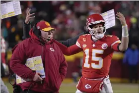  ?? ED ZURGA — THE ASSOCIATED PRESS ?? Chiefs head coach Andy Reid, left, and quarterbac­k Patrick Mahomes react toward officials during the first half of an NFL wild-card playoff football game against the Dolphins on Jan. 13in Kansas City, Mo.