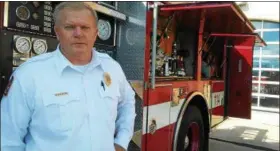  ?? BETSY SCOTT — THE NEWS-HERALD ?? Mentor Fire Chief Bob Searles discusses the need for new levy money to meet equipment needs, such as replacing this 25-year-old engine with more than 132,000 miles.