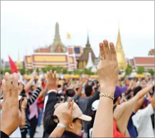  ?? AFP ?? Pro-democracy protesters have long used the three-finger salute as a gesture of protest against dictatorsh­ip.