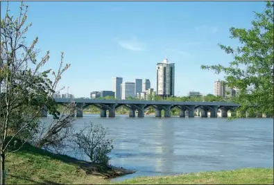  ?? Special to the Democrat-Gazette/MATT MEYER ?? The 21st Street Bridge over the Arkansas River in Tulsa is shown in this photo from the River Parks Authority. Water released from Keystone Dam fills the river at night, but efforts are under way to add more water during the daytime.