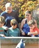  ?? PHOTOS COURTESY LORIE DALEY ?? Ken and Lorie Lewis in 2009, with Lorie’s three children: Zach, Andrew and Sean.