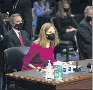  ?? CAROLINE BREHMAN — POOL VIA AP ?? Supreme Court nominee Amy Coney Barrett arrives for her Senate Judiciary Committee confirmati­on hearing on Capitol Hill in Washington Monday.