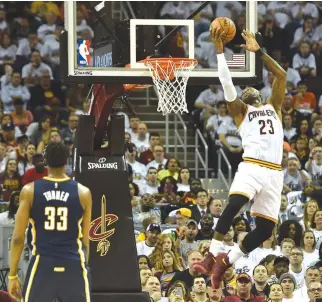  ??  ?? CLEVELAND CAVALIERS forward LeBron James dunks in the second quarter against the Indiana Pacers in Game One of their first round 2017 NBA Playoff matchup at Quicken Loans Arena.