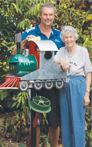  ?? Picture: ANNA ROGERS ?? FULL STEAM AHEAD: No, it’s not Thomas. Adrian Keirle and his mother Marjorie in front of their steam train letterbox that Adrian made out of bits and pieces.