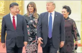  ?? REUTERS ?? ▪ US President Donald Trump and his Melania arrive for a state dinner with Chinese President Xi Jinping and his Peng Liyuan at the Great Hall of the People in Beijing on Thursday.