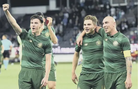  ??  ?? 2 Kieran Tierney, James Forrest and Scott Brown celebrate at full-time in Trondheim on Wednesday. Their next tie will be tougher says manager Brendan Rodgers.