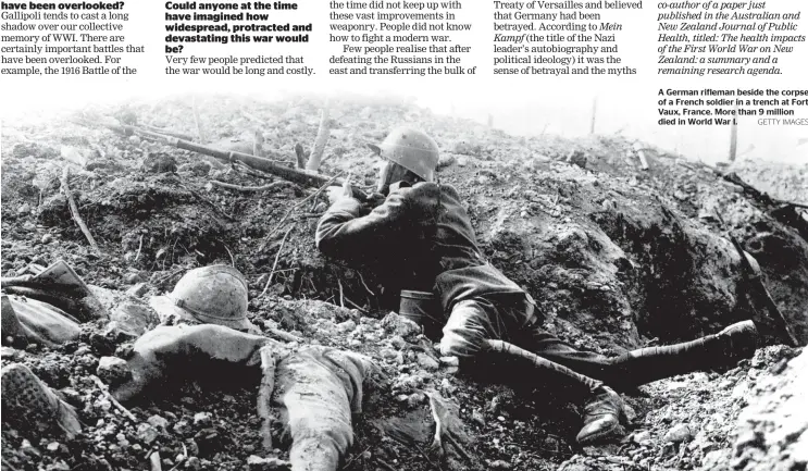  ?? GETTY IMAGES ?? A German rifleman beside the corpse of a French soldier in a trench at Fort Vaux, France. More than 9 million died in World War I.