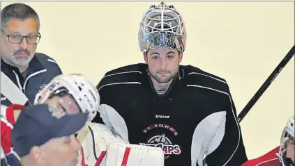  ?? DEREK MONTAGUE/THE WESTERN STAR ?? Eddie Pasquale (centre), who signed an AHL contract with the Montreal Canadiens over the summer, is looking for a second go-around with the St. John’s IceCaps. The netminder from Toronto played 112 regular season games over three seasons with the...