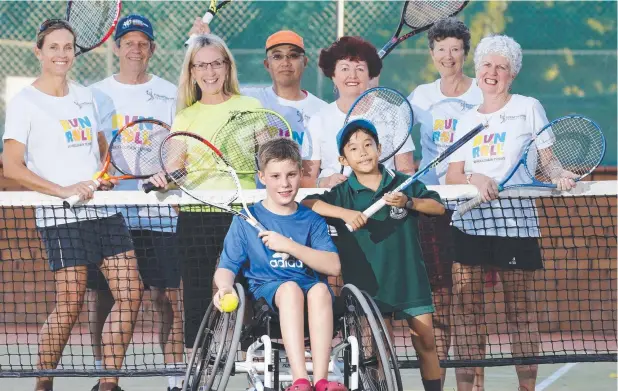  ?? Picture: ANNA ROGERS ?? HAVING A BALL: Run and Roll FNQ wheelchair tennis organisers Jen Rees from Tennis Queensland, Brian Davis, Councillor Linda Cooper, Victor Debuque, Del Davis, Jane Docherty and Margaret Linklater, and players Ben Wenzel, 10, and Sergio Debuque, 9, are...