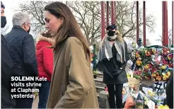  ??  ?? SOLEMN Kate visits shrine at Clapham yesterday