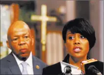  ?? Shannon Stapleton/ ReuteRs ?? Baltimore mayor Stephanie Rawlings-Blake speaks Sunday during a news conference on the demonstrat­ions for Freddie Gray in Baltimore. Behind the mayor is U.S. Rep. Elijah Cummings, D-Md.