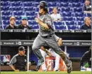  ?? MARK BROWN / ?? Diamondbac­ks pitcher Zack Greinke runs toward home in front of many empty seats at Marlins Park.