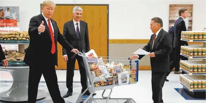  ??  ?? US President Donald Trump visits a food distributi­on centre in Salt Lake City, Utah, this week.