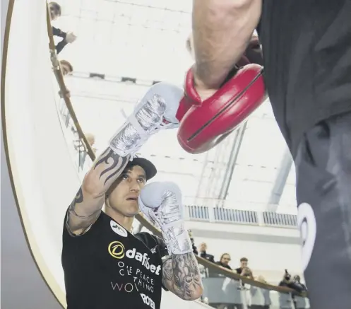  ?? PICTURE: PAUL DEVLIN/SNS GROUP ?? 0 Ricky Burns trains during a public workout at the St Enoch Centre, Glasgow, yesterday.
