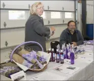  ?? SUBMITTED PHOTO ?? Scott, right, and Anna Larsen, left, of Windy Hill Farm, specialize in English Lavender which then is used in their products. They also manage a 50-tree orchard and harvest seasonal fresh produce for their farm stand. This photo shows the Windy Hill Farm display at the 2018 Agricultur­al Summit.