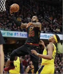  ?? ASSOCIATED PRESS ?? LeBron James glides to the basket over the Indiana Pacers’ Myles Turner (33) in Game 7 of the Cavs-Pacers series.