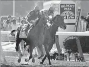  ?? Carolyn Cole
Los Angeles Times ?? CALIFORNIA CHROME, left, finished fourth in the 2014 Belmont Stakes, missing the Triple Crown. He races today at Santa Anita in the San Pasqual Stakes.