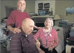  ?? DAI SUGANO — STAFF PHOTOGRAPH­ER ?? Christie Bilikam, right, lives in her Palo Alto home with her husband, Ed, left, and his twin brother, Bob, who are both suffering from dementia.