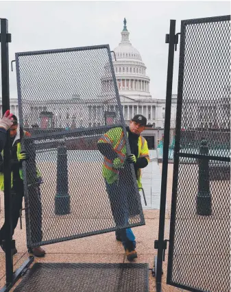  ?? Pictures: Getty Images/AFP/Reuters ?? Steel fencing goes up around the US Capitol ahead of the State of the Union address by President Joe Biden (right). He faces Republican Donald Trump (below) in the November 5 election.