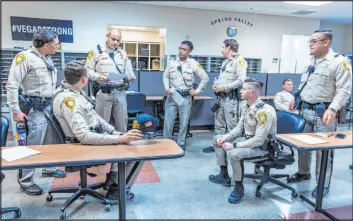  ?? ?? Metro officers gather for a briefing prior to an April DUI blitz. The blitzes are designed to catch impaired drivers and to train officers to better conduct DUI investigat­ions.