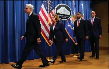  ?? (AP/Andrew Harnik) ?? Attorney General Merrick Garland leaves a news conference Friday in Washington after announcing Jack Smith as special counsel. Following (from left) are Deputy Attorney General Lisa Monaco, Assistant Attorney General for the Criminal Division Kenneth Polite and U.S. Attorney for the District of Columbia Matthew Graves.