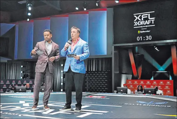  ?? XFL ?? Russ Brandon, right, the XFL’S president of football operations, attends the draft with Marc Ross, executive VP of football operations.