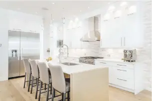  ??  ?? Right: Cabinet doors and drawers are made from Brookside veneer, a sustainabl­e product made from plantation trees. All the home’s cabinets and millwork are by Hobson Woodworks. Blond white oak engineered floors have a rustic look, thanks to long, wide planks with a bit of knotting.