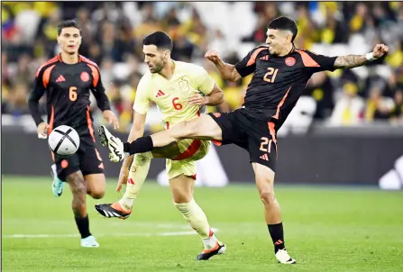  ?? — AFP photo ?? Colombia’s Daniel Munoz challenges Spain’s Mikel Merino during the internatio­nal friendly match at The London Stadium.