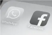  ??  ?? WhatsApp and Facebook app icons are seen on a smartphone in New York.