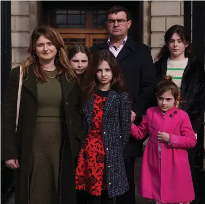  ?? ?? Decade of trauma: Rebecca and Tom Collins with their four daughters outside court yesterday