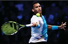  ?? — AFP file photo ?? Auger-Aliassime returns to Fritz during their round-robin match at the ATP Finals tennis tournament in Turin.