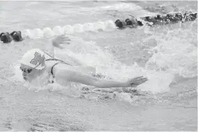  ??  ?? McGuinness' Macy Lewis competes in the 100-yard butterfly during the Class 5A state meet Tuesday in Edmond. [BRYAN TERRY/ THE OKLAHOMAN]