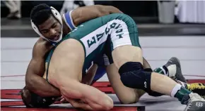  ?? SCOTT ASH / NOW NEWS GROUP ?? Whitefish Bay's Dajun Johnson, top, beat D.C. Everest's Gabe Carter in a Division 1 quarterfinal match at 170 pounds.