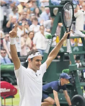  ?? Pictures / AP ?? Roger Federer defeated Marin Cilic in straight sets for his eighth Wimbledon title, 14 years after his first in 2003 (below).