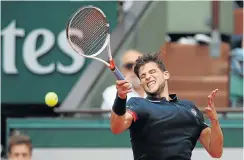  ??  ?? Dominic Thiem of Austria plays one of his pile-driving returns in the French Open men’s singles semifinal against Marco Cecchinato of Italy whom, he beat comfortabl­y.